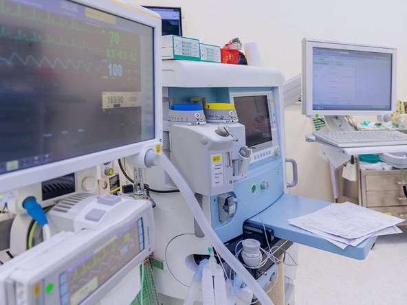 Biomedical Engineer Inspecting ICU Equipment